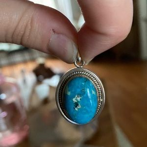 Large sterling silver and turquoise oval pendant.